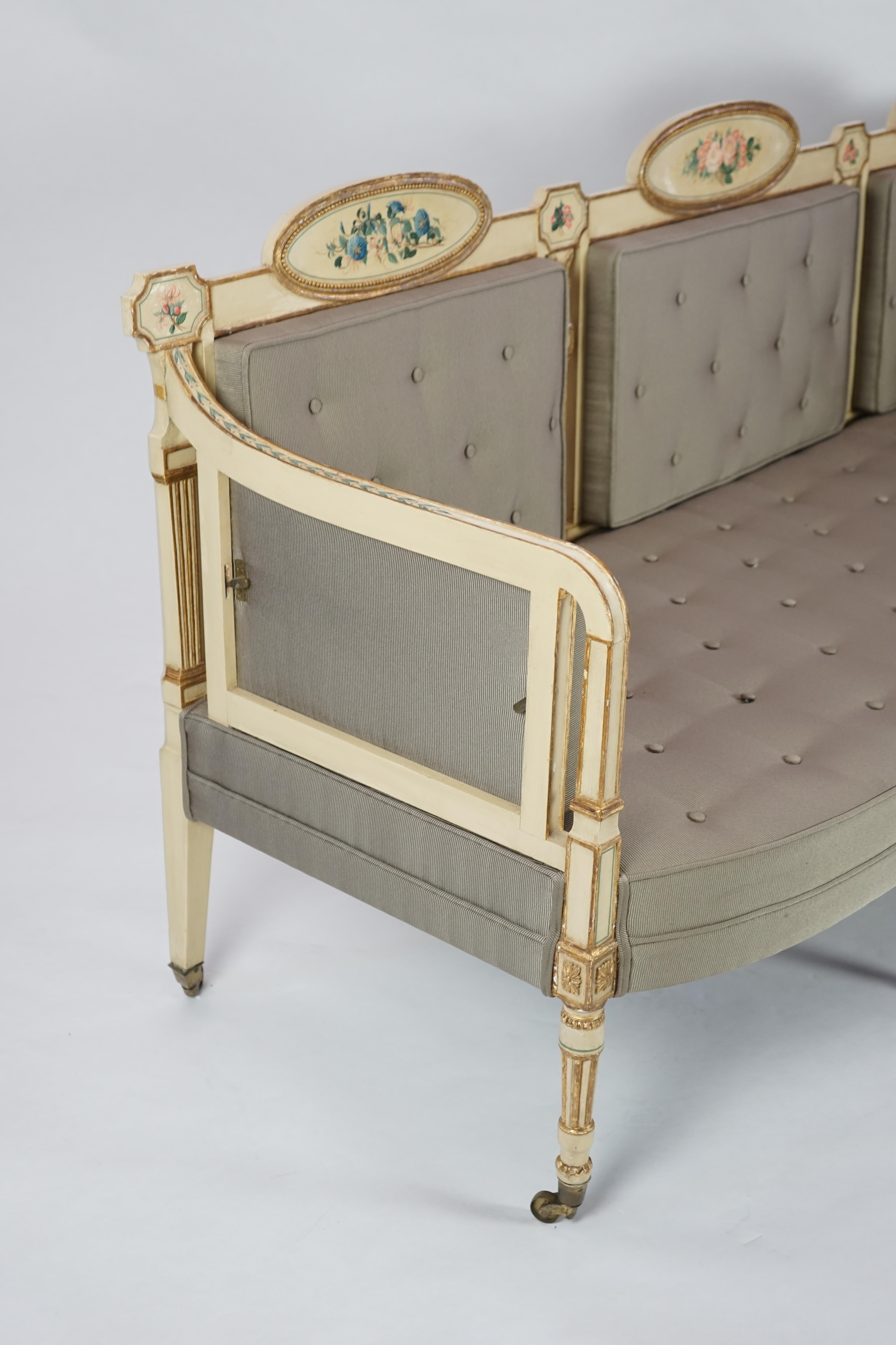 A pair of George III cream painted and parcel gilt settees, in the manner of George Brookshaw (1751-1823)